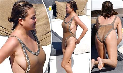 Chrissy Teigen Comes Close To A Nip Slip As Eye Popping Swimsuit