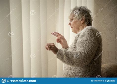 Nosey Neighbour Senior Woman Looking Through Window Stock Image