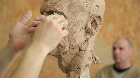Sculptor Modelling Sculpture Adjusting Face Details Head Made Of Clay