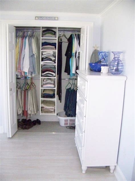 Bedroom Reach In Closet Design In White With Drawer System Addition