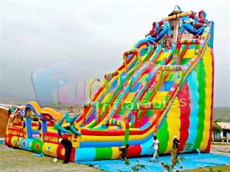 An Inflatable Water Slide With People Standing Around It