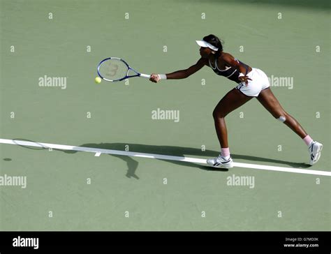 Venus Williams Of Usa Reaches For A Shot During Her Match Against Shuai
