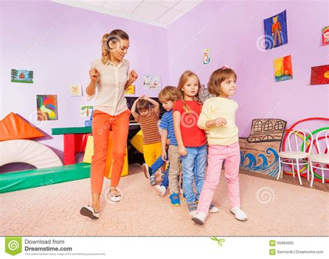 Dancing Lesson With Kids Repeat After Teacher Stock Image