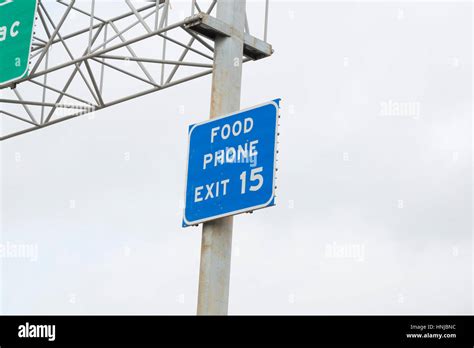 Exit Sign Marking Food And Phone Access Off A Highway Stock Photo Alamy