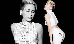 Miley Cyrus Displays Her Breasts In Mesh And Her Derriere In Pvc For