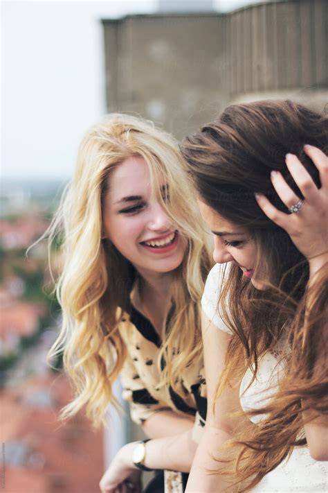 Two Female Friends Is Laughing By Stocksy Contributor Jovana Rikalo