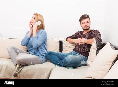 Cheating Wife Talking Privately On The Phone While Husband Waits On The