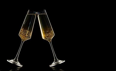 Premium Photo Two Glasses Of Champagne Clink Glasses On A Black Background