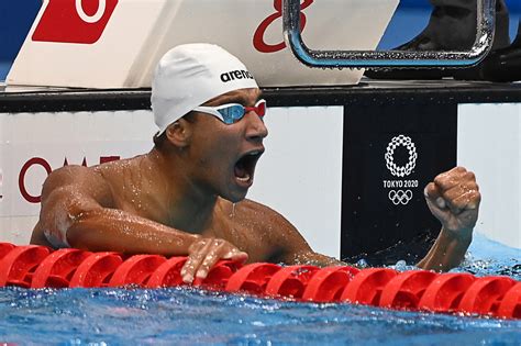 tunisian hafnawi unexpectedly wins olympic swimming gold medal olympic news