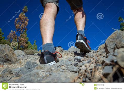 Close Up Of Hikers Legs Walking In Rocky Mountains Stock Photo Image