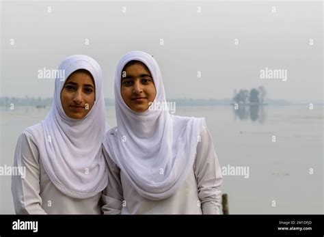 A Portrait Of Two Kashmiri School Girls In Their School Dress Covering
