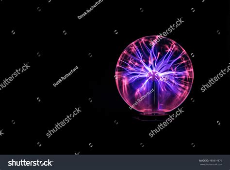 Plasma Globe Lit Against Black Background Stock Photo 489814876