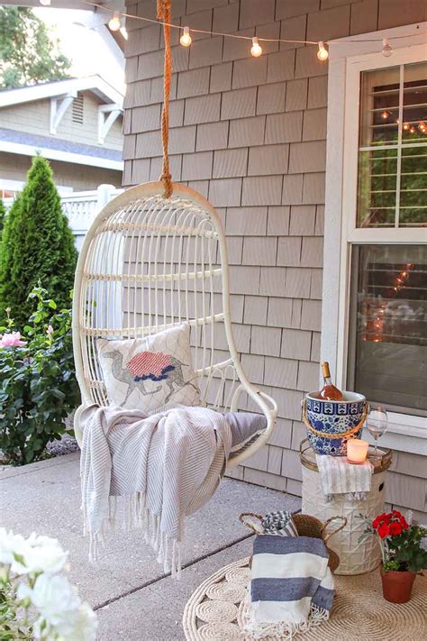 Easy and affordable front porch decor ideas you can do to create a welcoming curb appeal for your home using a plaid rug, rocking chairs and some paint. My Summer Front Porch Tour & A Rosé Cocktail Recipe