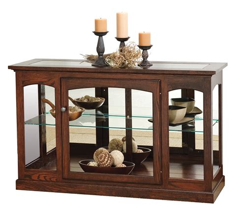 We offer free shipping on all our console curio cabinets. Console Curio Cabinet from DutchCrafters Amish Furniture