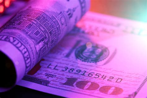 Hundred Dollar Bill In Abstract Lighting Stock Photo Download Image