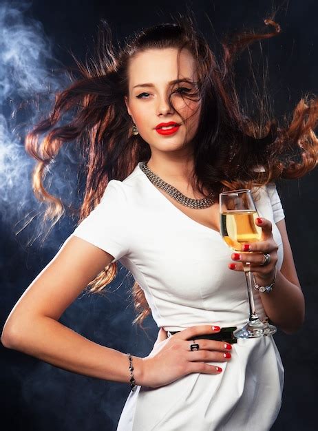 Premium Photo Smiling Woman In Evening Dress With Glass Of Sparkling Wine