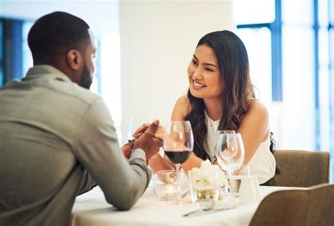 Premium Photo Wine Date And Interracial Couple Holding Hands For Fine Dining Restaurant Or