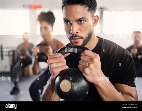 Strong Man Personal Trainer And Group Training With Kettlebell Squat