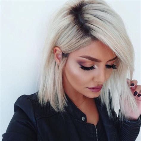 The blonde hair dark root trend is perfect for women looking to keep the length and add dimension. Pin by 𝓂𝑒𝓁∬ on hair | Bleach blonde hair, Dark roots ...