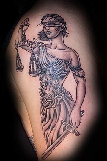 A Lady Justice Tattoo On The Arm