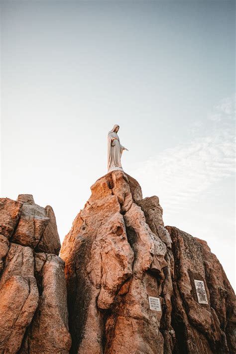 Virgin Mary Statue On Rock Boulder Photo Free Apparel Image On