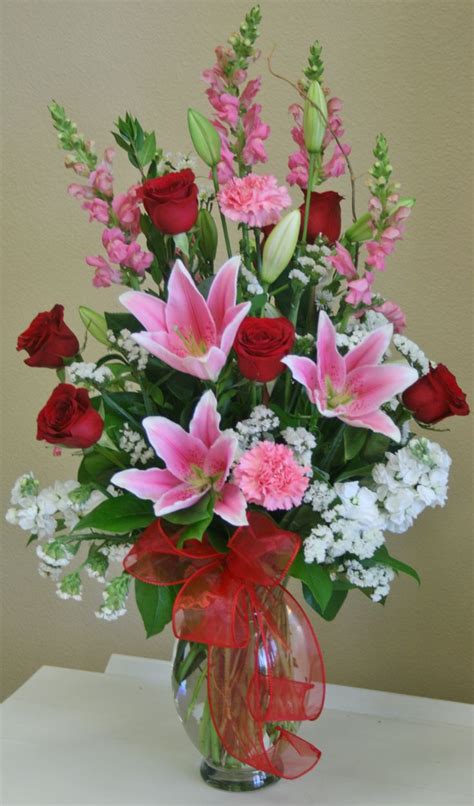 A Romantic Red White And Pink Flower Arrangement By Your Local