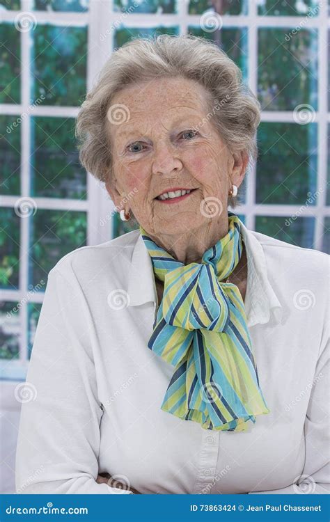 Portrait Of An Attractive Elegant Senior Woman Relaxing At Home Stock