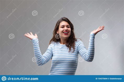 Happy Joyful Young Woman Gesturing With Her Hands Stock Photo Image
