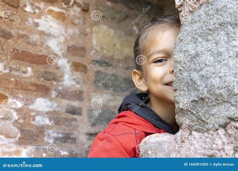 Portrait Of Little Boy Child Hiding While Playing Game Stock Image