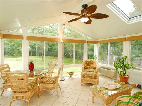 White Cottage Sunroom With Tan Wicker Furniture And Tile Floor Hgtv