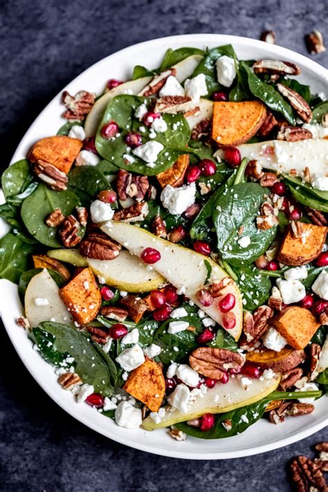 Roasted Sweet Potato Pear And Pomegranate Spinach Salad Ambitious Kitchen
