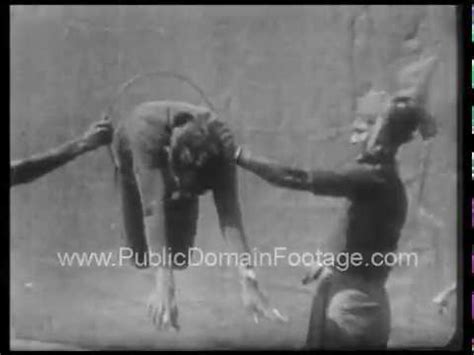 Jumping through hoops stock images. Man jumping through hoop 1930 archival footage ...