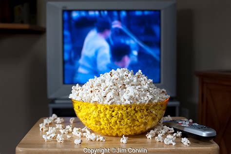 Watching Tv With Bowl Of Popcorn Jim Corwin Photographer