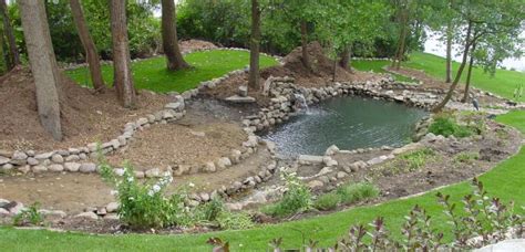 Many gardeners and landscape designers incorporate berms in the landscape. Brighton, MI Landscape Drainage | 3D Design Group