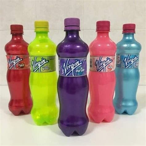 six different colored soda bottles lined up in a row