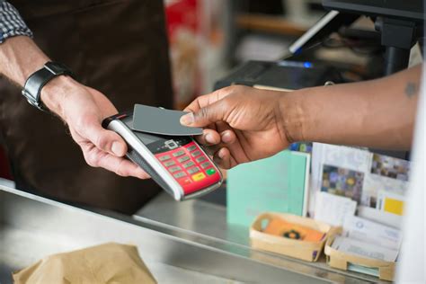 Person Paying Using A Bank Card · Free Stock Photo