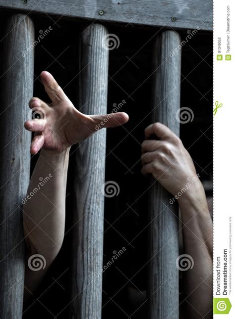 Prisoner Behind Wooden Bars Begging For Help Stock Photo Image Of