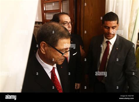 tunisia s prime minister youssef chahed r with habib essid during the handover ceremony in