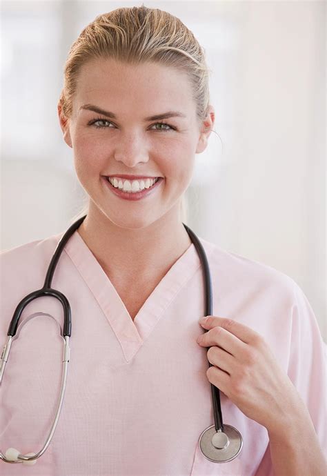 Female Medical Professional Or Doctor Holding Onto Her Stethoscope StockFreedom Premium