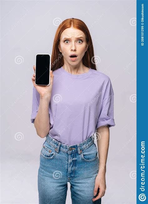 Annoyed Young Woman Wearing Stylish Clothes Holding Cell Phone With