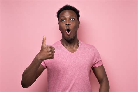 Surprised Handsome Black Man Showing Thumb Up Giving Advice Stock Photo