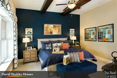 Owners Retreat With Exposed Beams And Deep Blue Accent