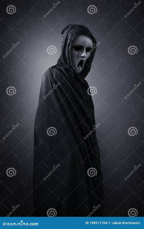 Ghostly Figure In Hooded Cloak Stock Photo Image Of Ghostly