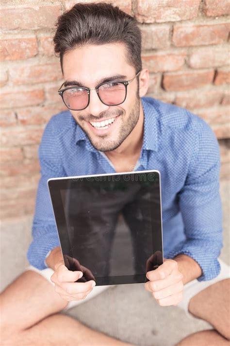 Happy Man Showing The Empty Screen Of His Tablet Pad Stock Image