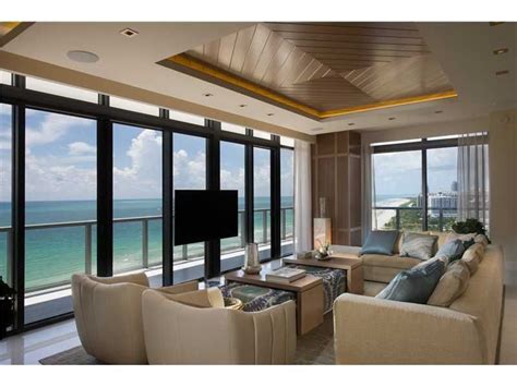 An Incredible Living Room With Beautiful Beige Furniture And Views Of