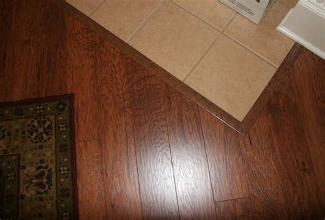 During the flooring installation laying laminate in a doorway perfectly is not so difficult when you start laying the floor boards at the wall that has the door in it. Laminate To Tile Transition Project : Fence and Gate Ideas ...