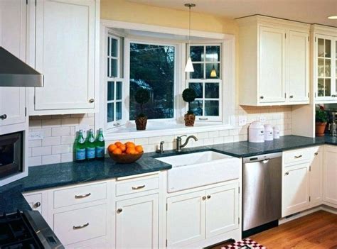Black & white cottage kitchen with apron sink. Kitchen Sink Bay Window Ideas | Kitchen sink window ...