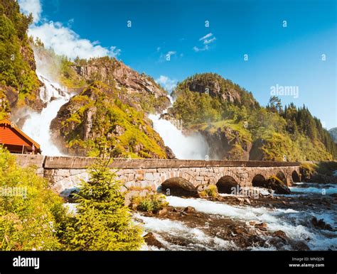 Summer Latefossen Waterfall Odda Norway With The Stone Road Bridge