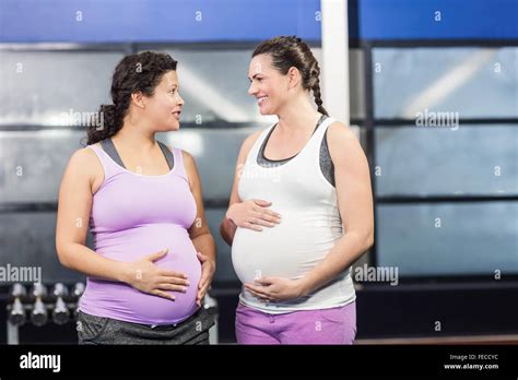 Smiling Pregnant Women Touching Their Belly Stock Photo Alamy