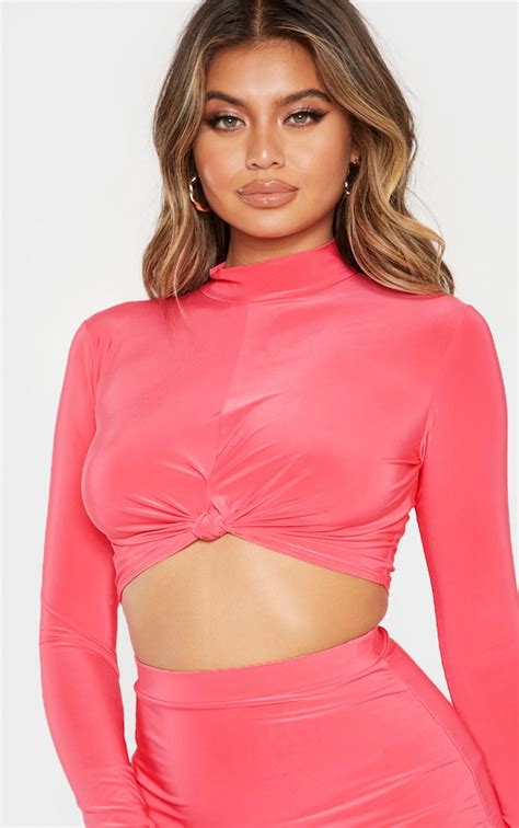 Coral Slinky High Neck Knot Front Long Sleeve Crop Top Prettylittlething